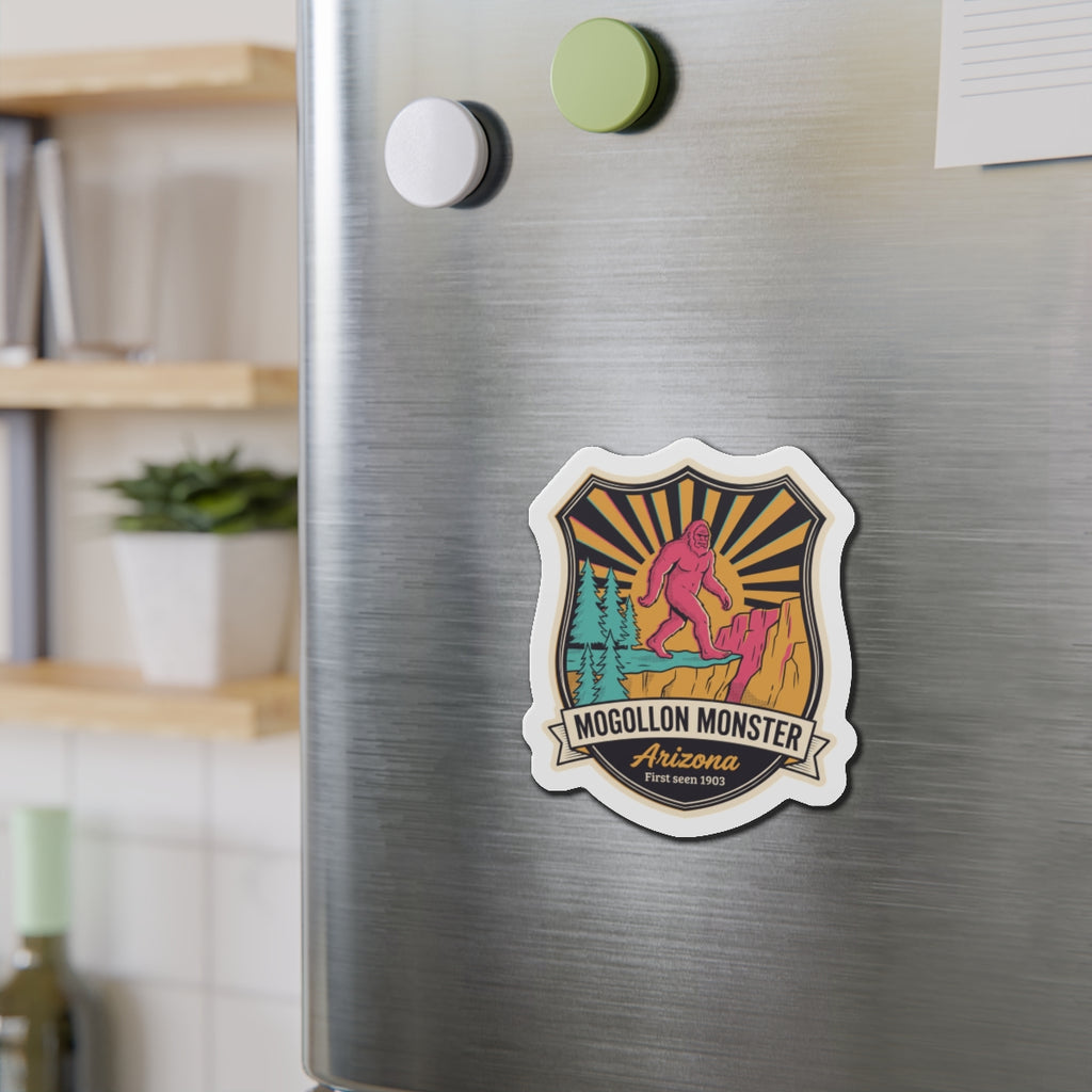 Die-cut badge magnet with pink Bigfoot-style monster, mountains, and Arizona text