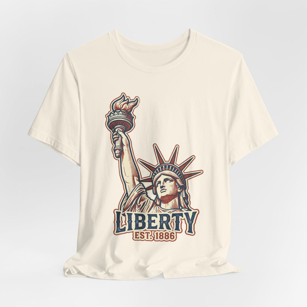Cream graphic tee with Liberty statue illustration and 'LIBERTY EST.1886' text
