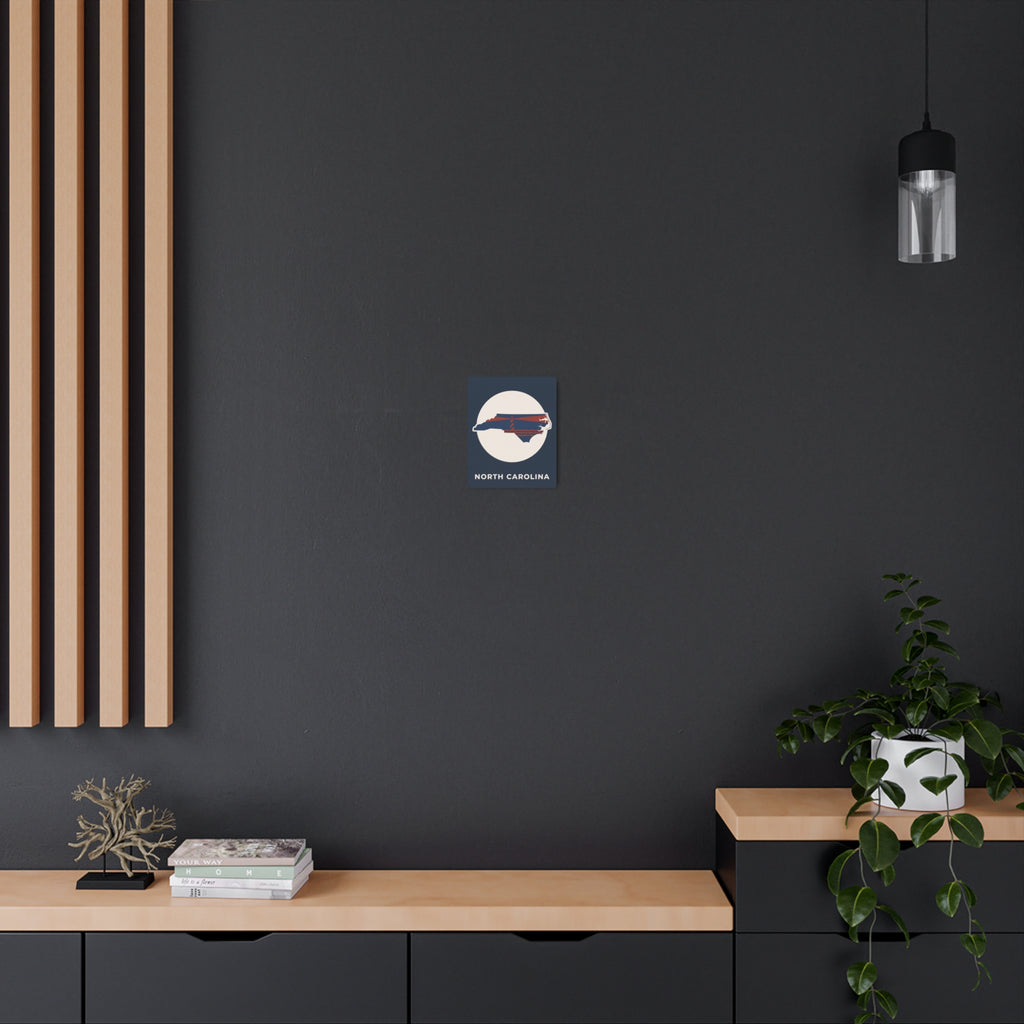 North Carolina metal art sign, small circular lighthouse emblem with state outline