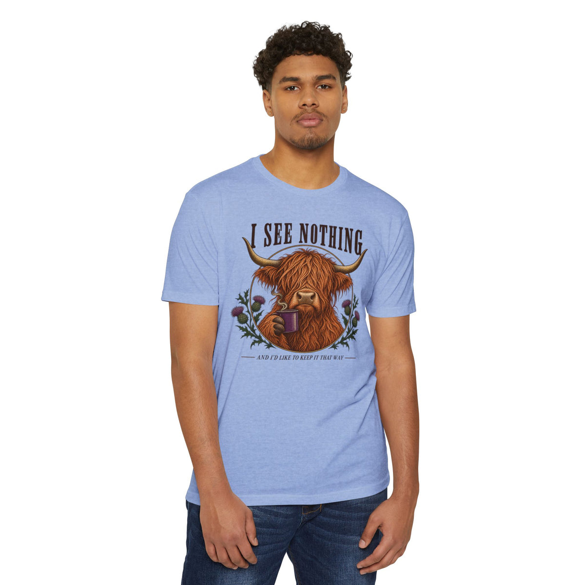 Light blue crewneck T-shirt with Highland cow “I See Nothing” graphic