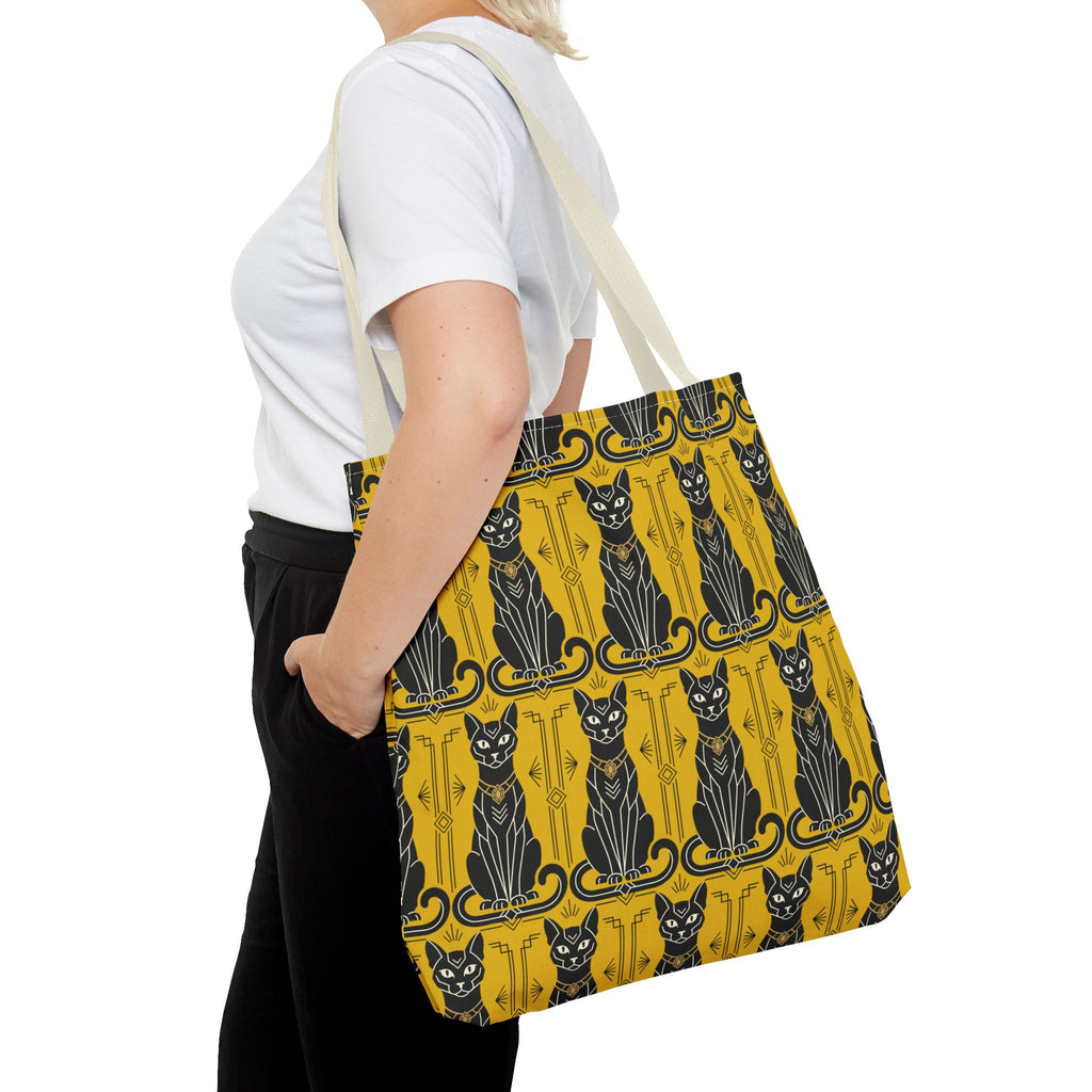 Yellow tote bag with repeating black cat and decorative motif, navy blue handles