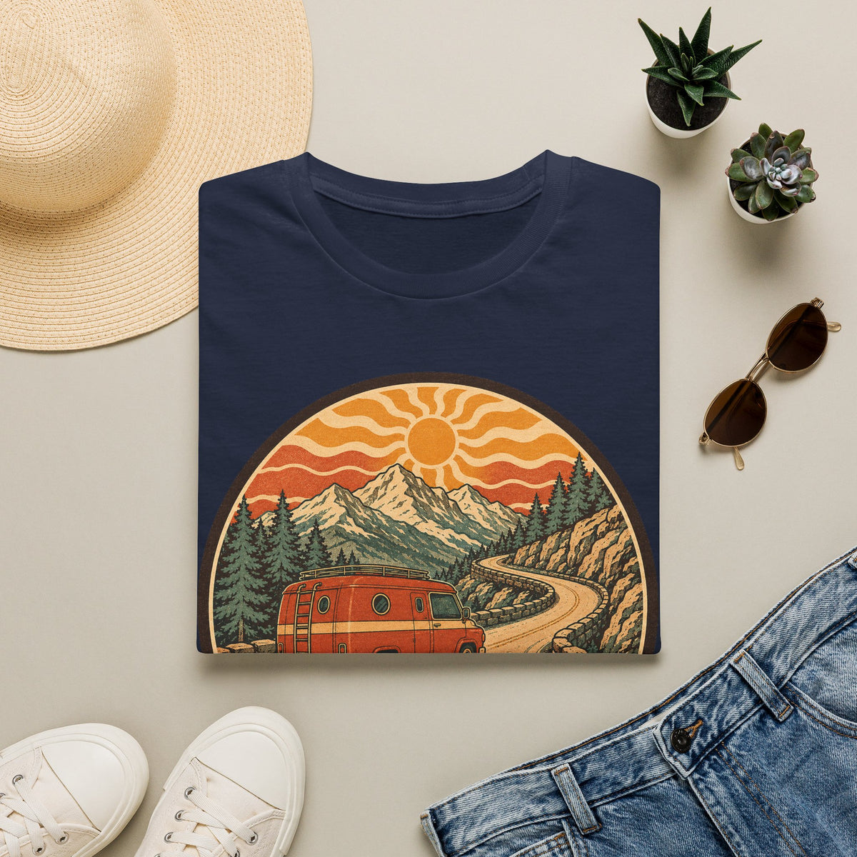 Unisex T-shirt in navy blue with crew neck and mountain sunset van graphic on front.