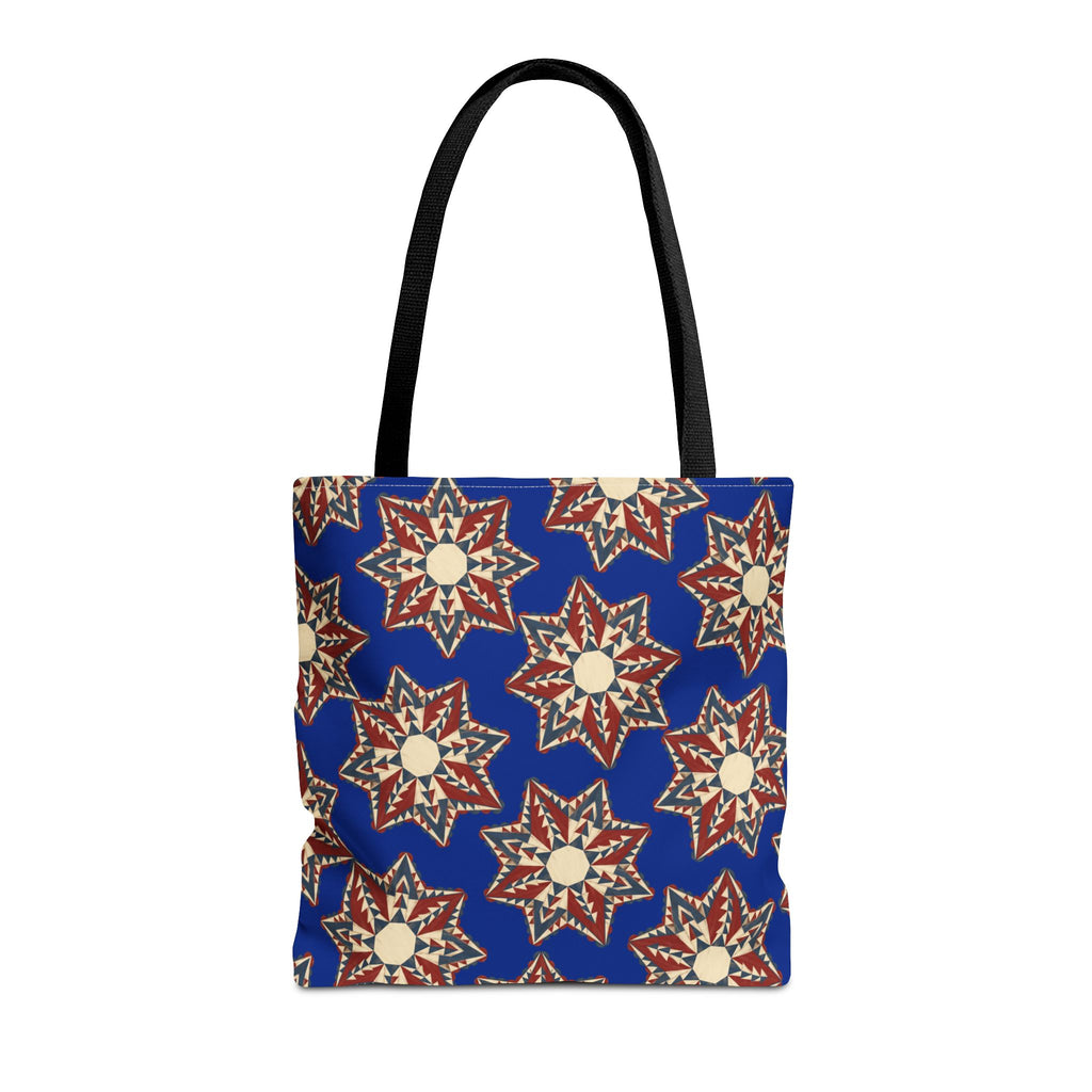 Blue tote bag with starburst floral pattern and black shoulder handles