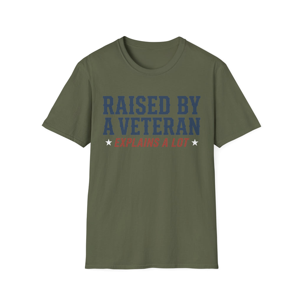 Olive green crewneck T-shirt with 'RAISED BY A VETERAN' and 'EXPLAINS A LOT' graphic