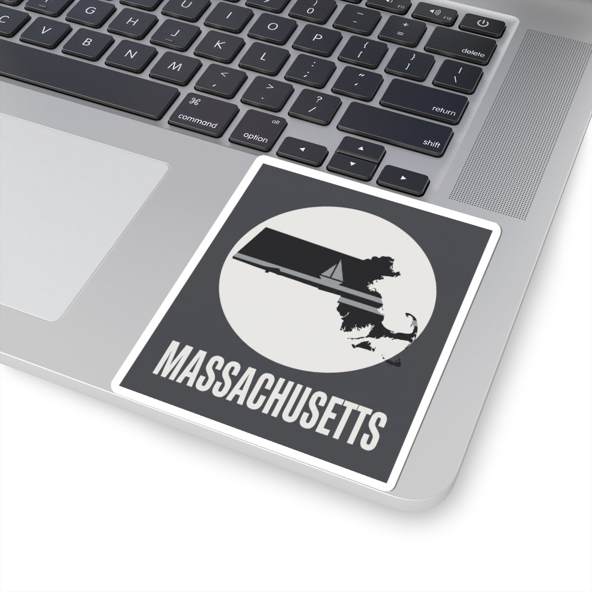 Massachusetts sailboat silhouette sticker with “MASSACHUSETTS” text, on laptop lid