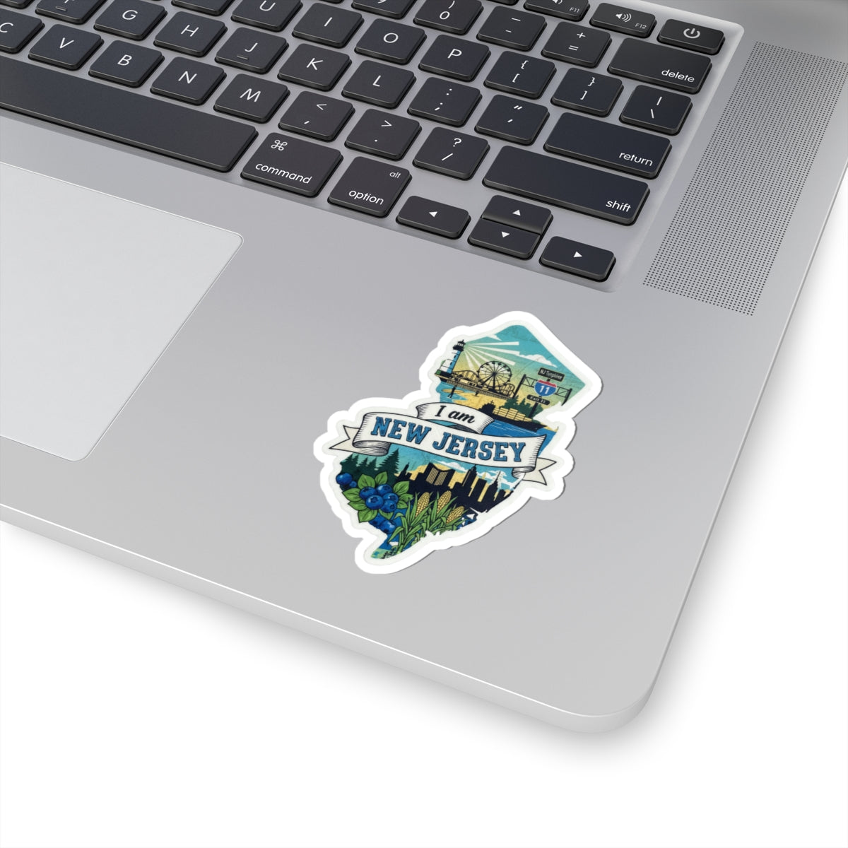 I Am New Jersey sticker on laptop lid, blue New Jersey banner and skyline