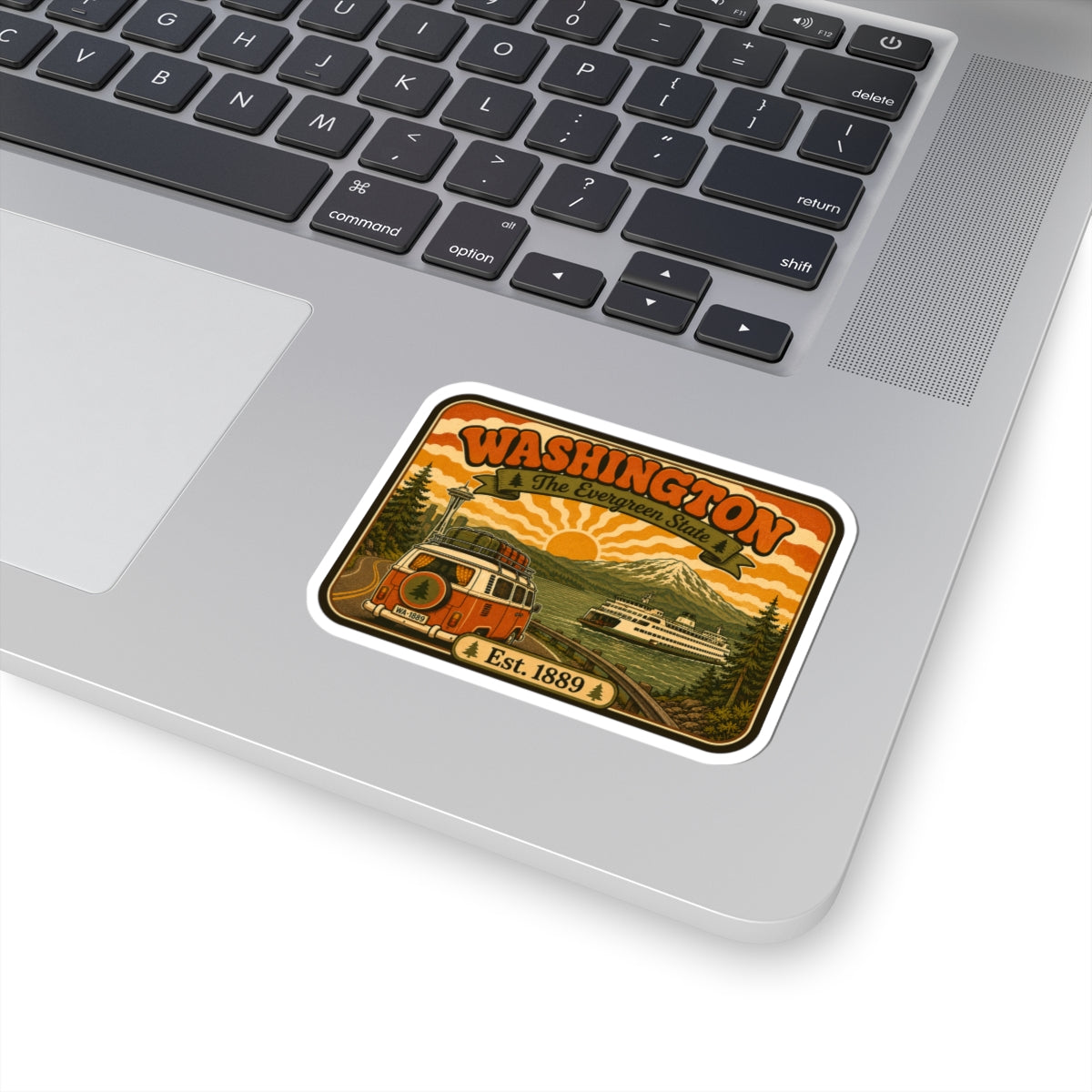 Kiss-cut Washington vintage sticker on laptop, white border with bus and scenic mountain illustration