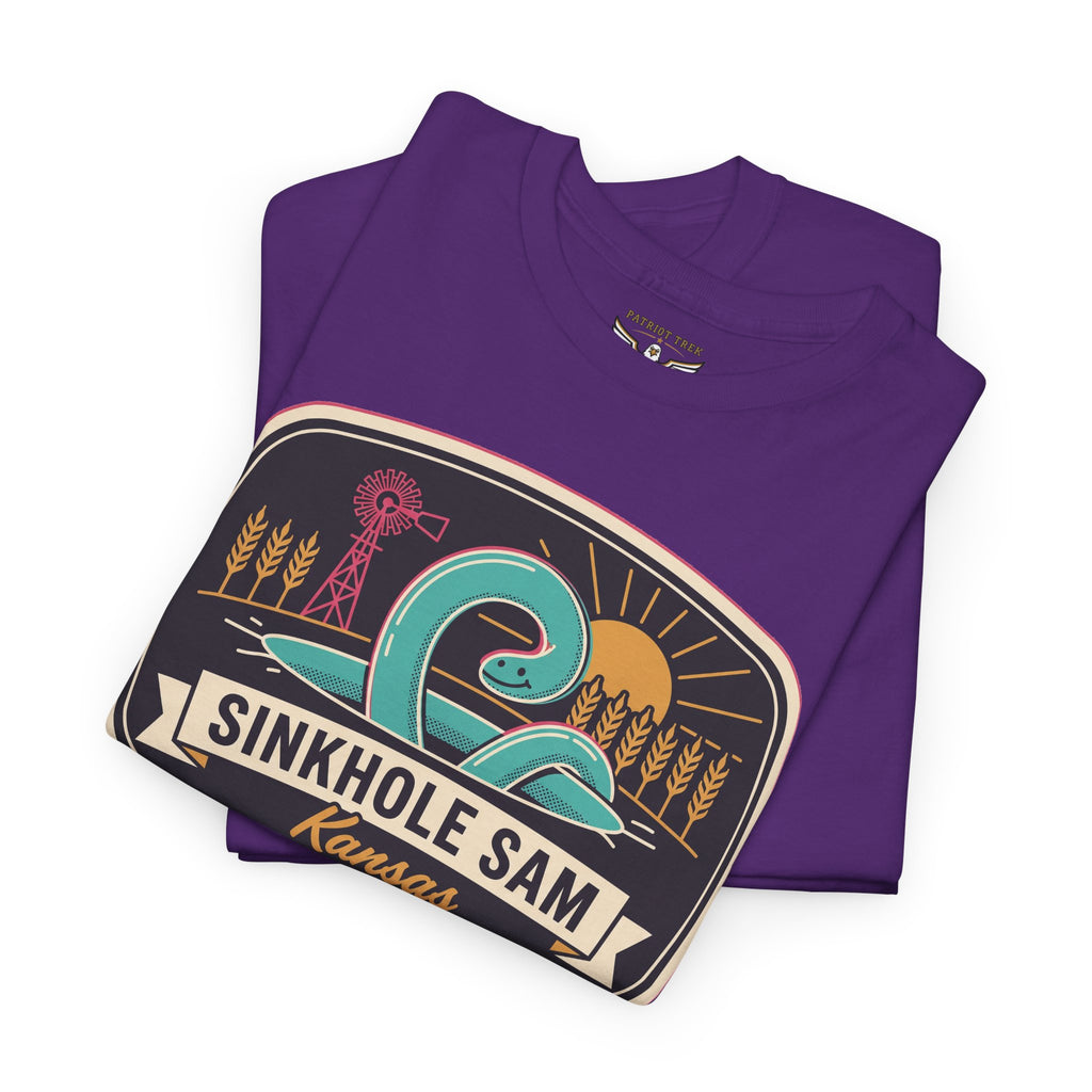 Purple folded T-shirt showing large retro Kansas badge graphic across the front