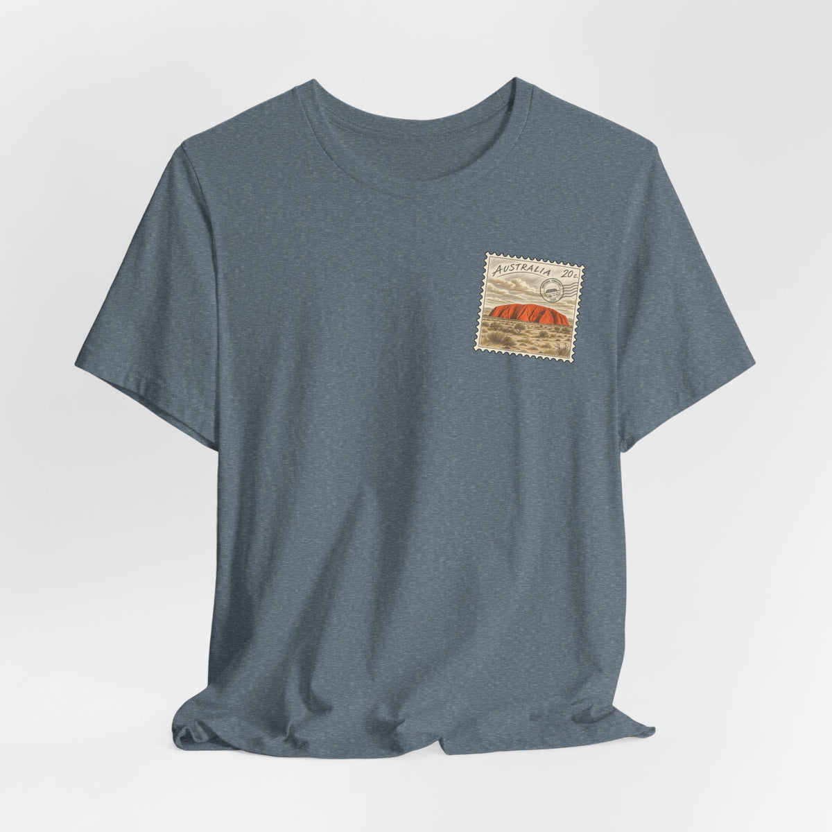 Slate blue crewneck T-shirt with small postage-stamp style chest graphic