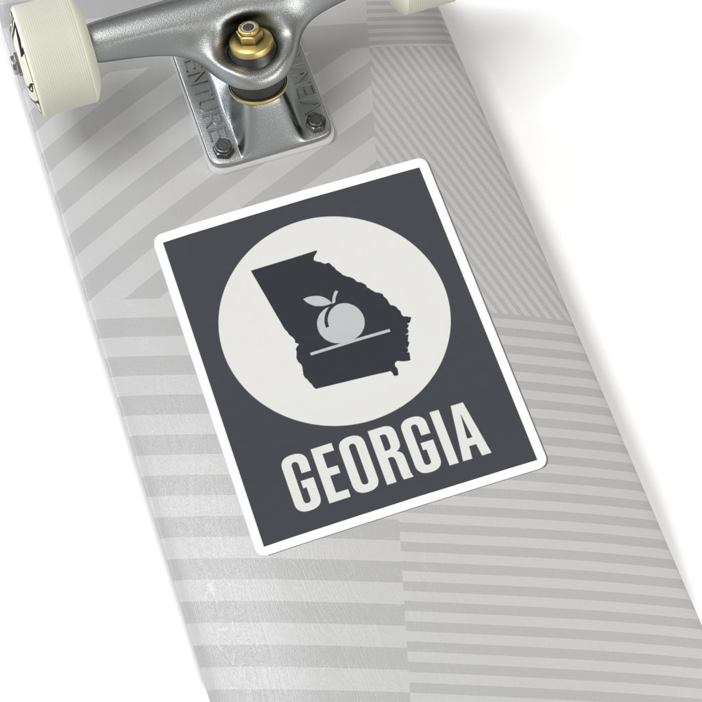Square vinyl sticker with Georgia text and state silhouette peach icon, black-and-white.