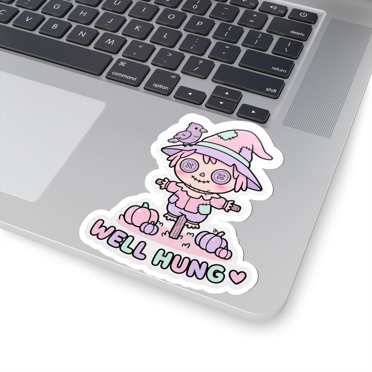 Pastel scarecrow bunny kiss-cut sticker with bird on hat and “WELL HUNG” lettering