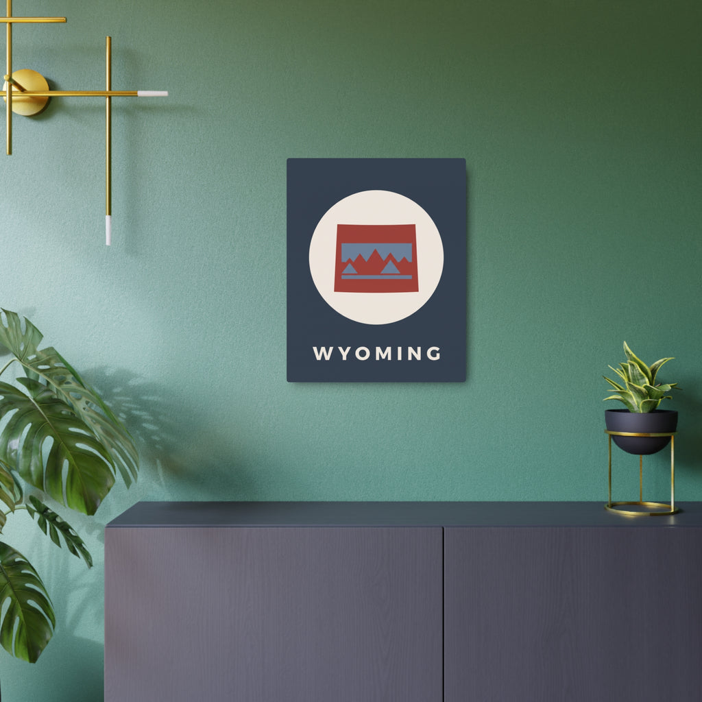 Square metal Wyoming badge sign with circular mountain icon and WYOMING lettering on dark blue