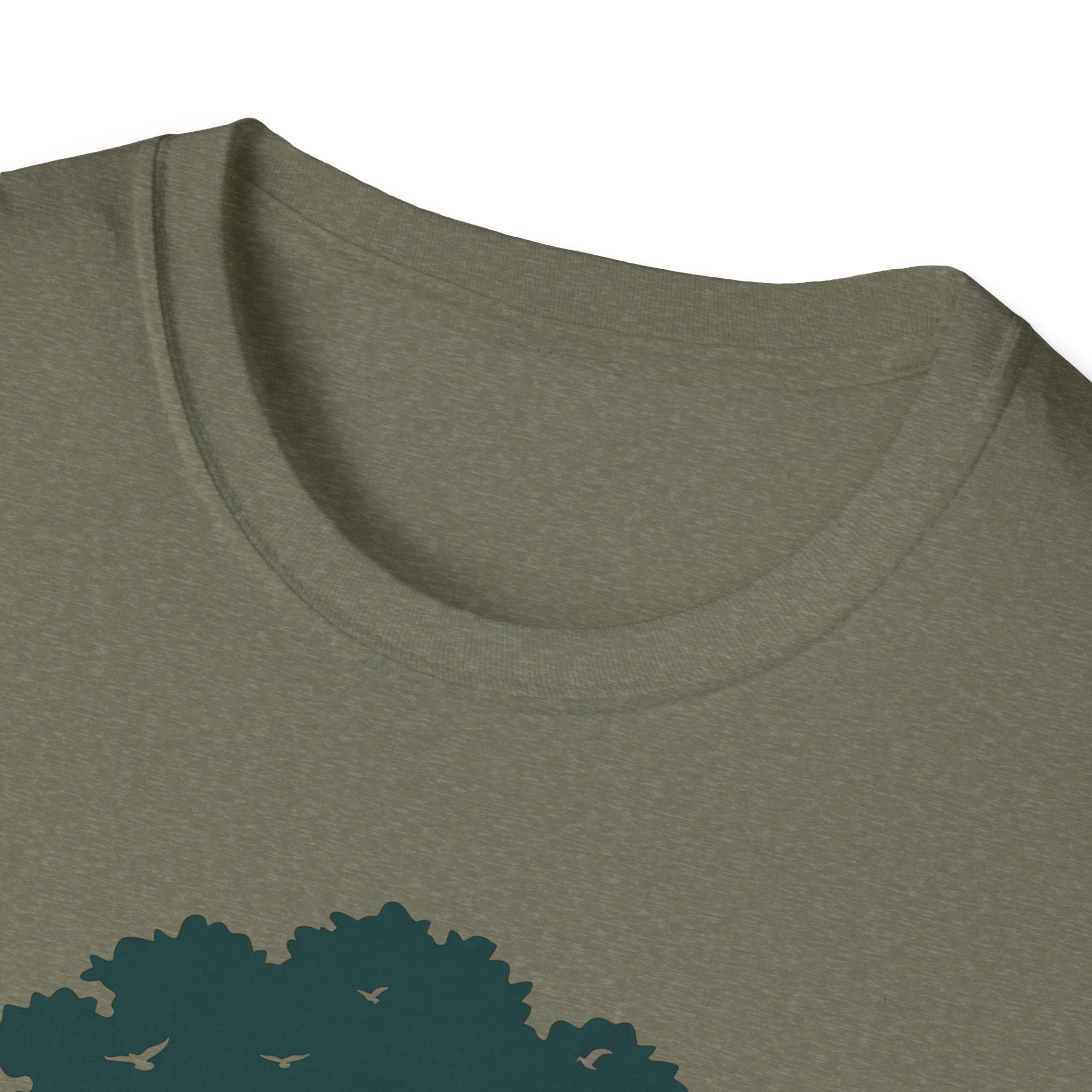 Olive tee neckline close-up with partial teal tree-and-birds graphic