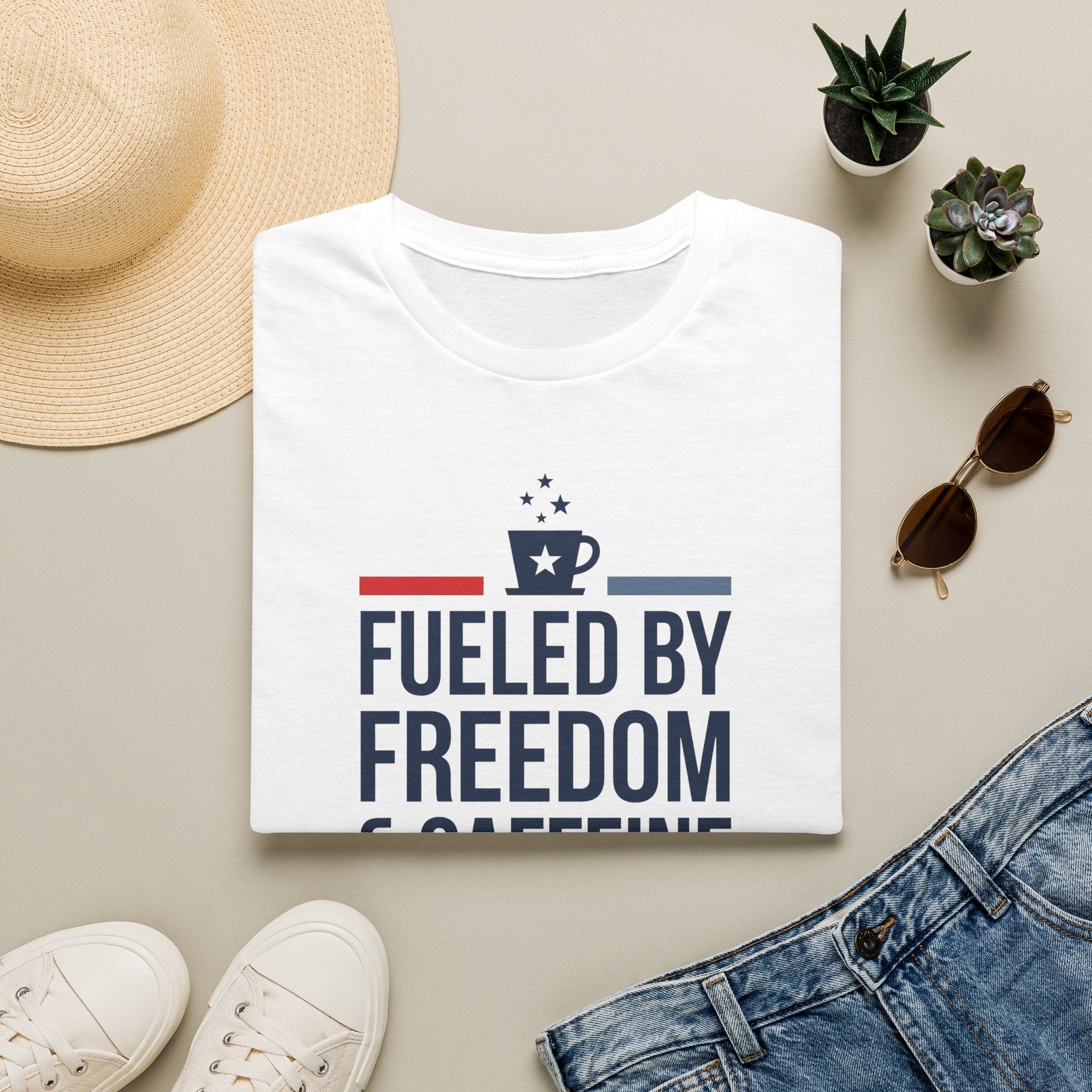 White unisex crew-neck T-shirt with bold front graphic reading “Fueled by Freedom”