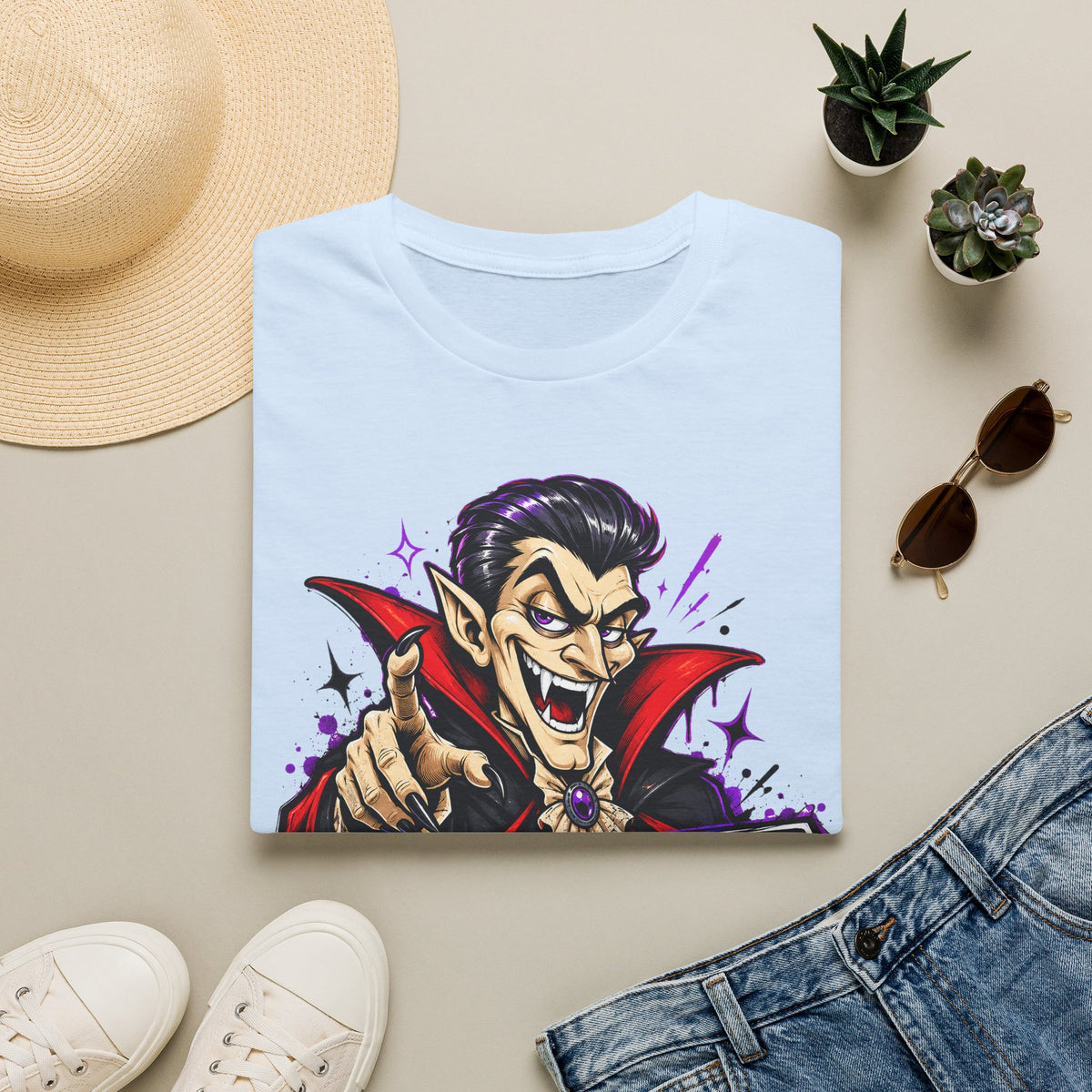 Light blue T-shirt with colorful cartoon vampire pointing graphic