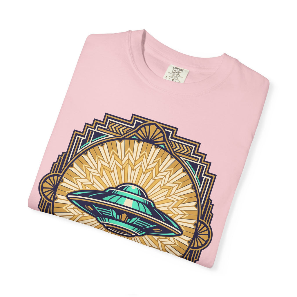Pink UFO graphic T-shirt close-up with teal saucer and sunburst