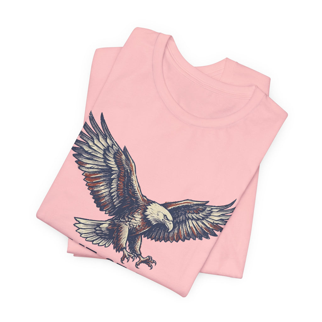 Soft pink crew-neck T-shirt with flying bald eagle graphic on front.