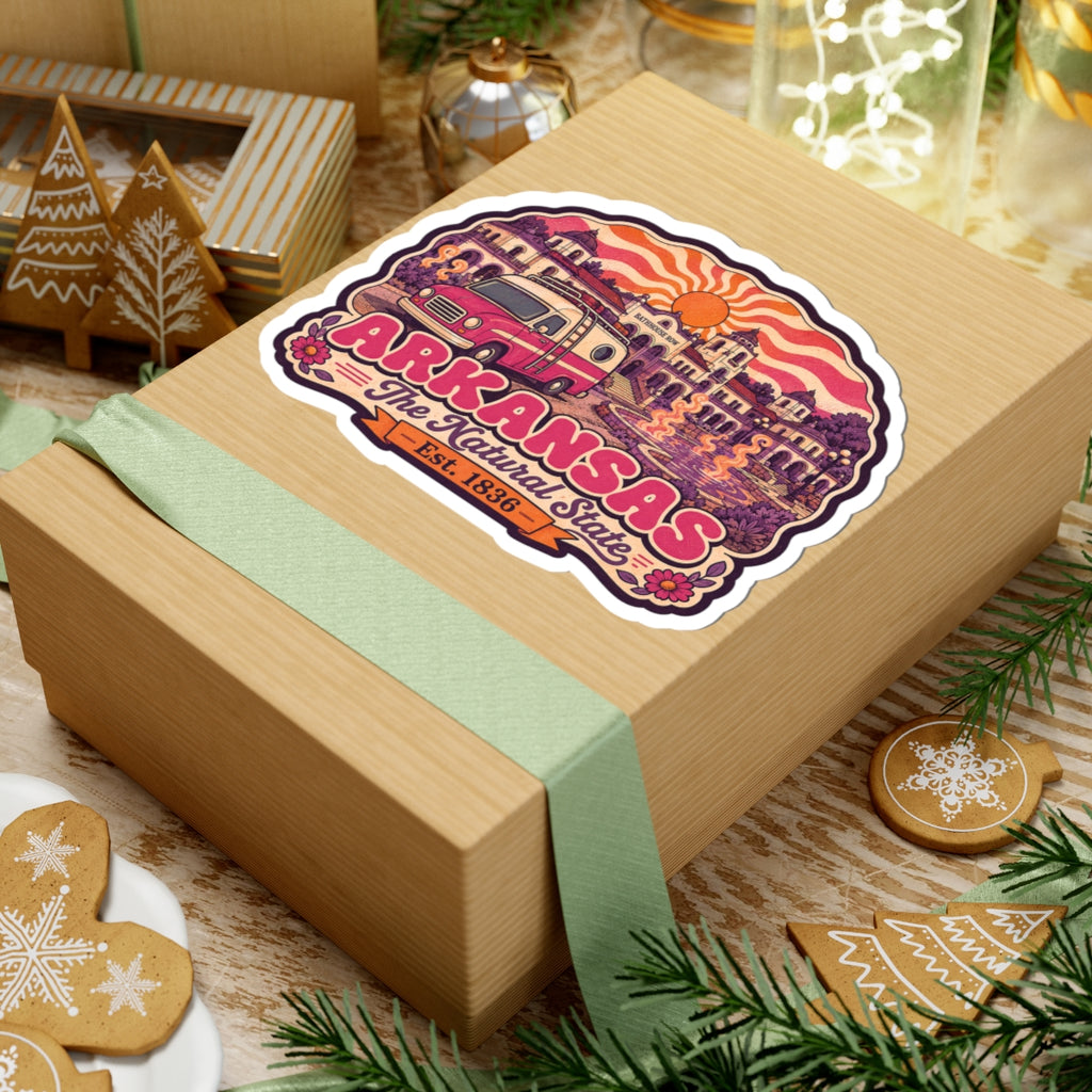 Kiss-cut Arkansas sticker on gift box ribbon, showing pink van, skyline, and “Arkansas” text