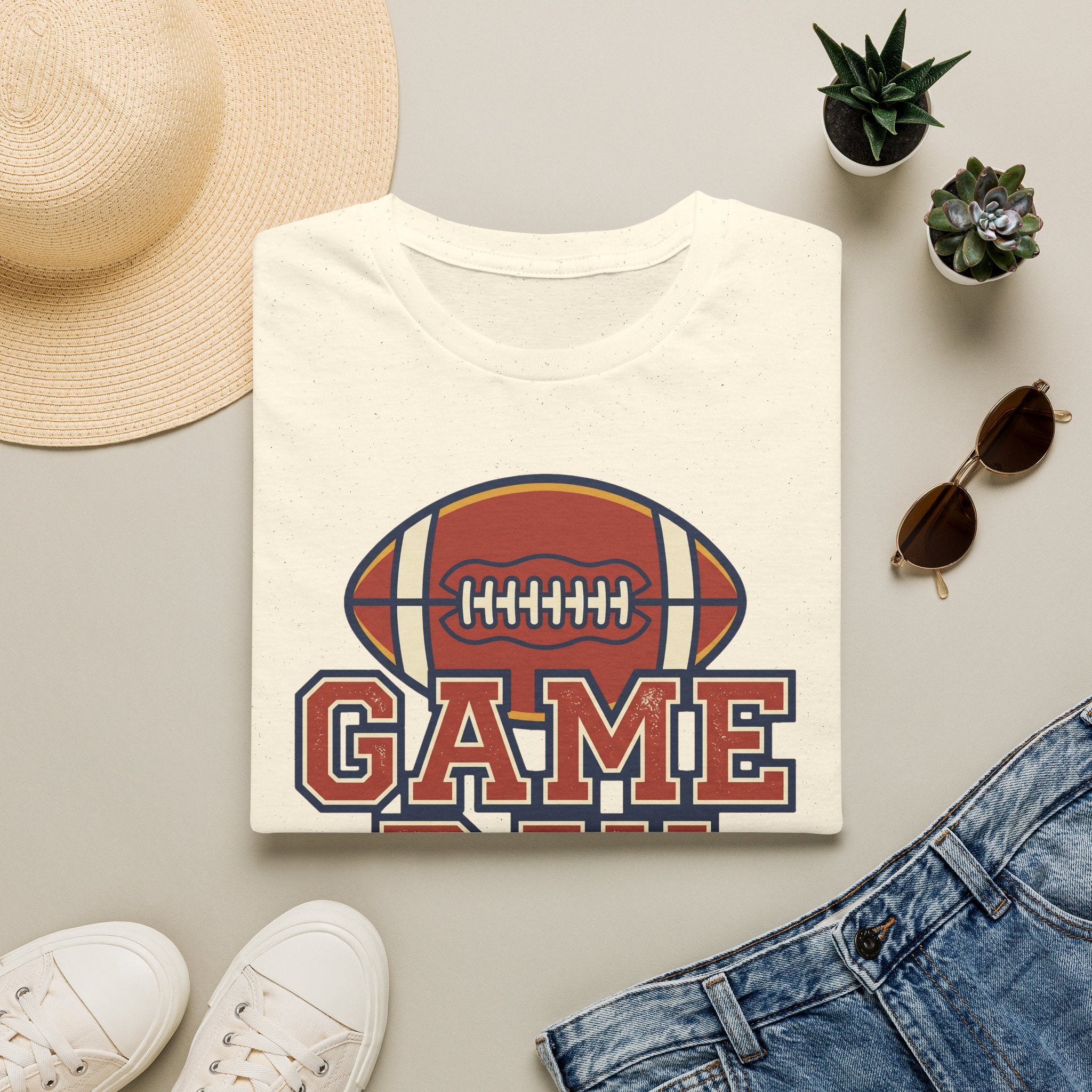 White football t-shirt with “GAME” text and football emblem graphic on center front