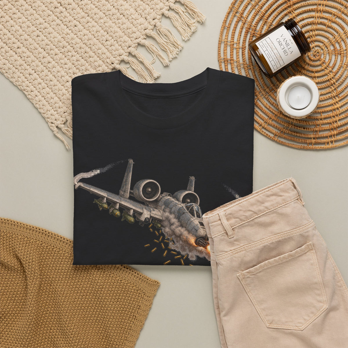 Black short-sleeve crewneck T-shirt with jet attack graphic on front.