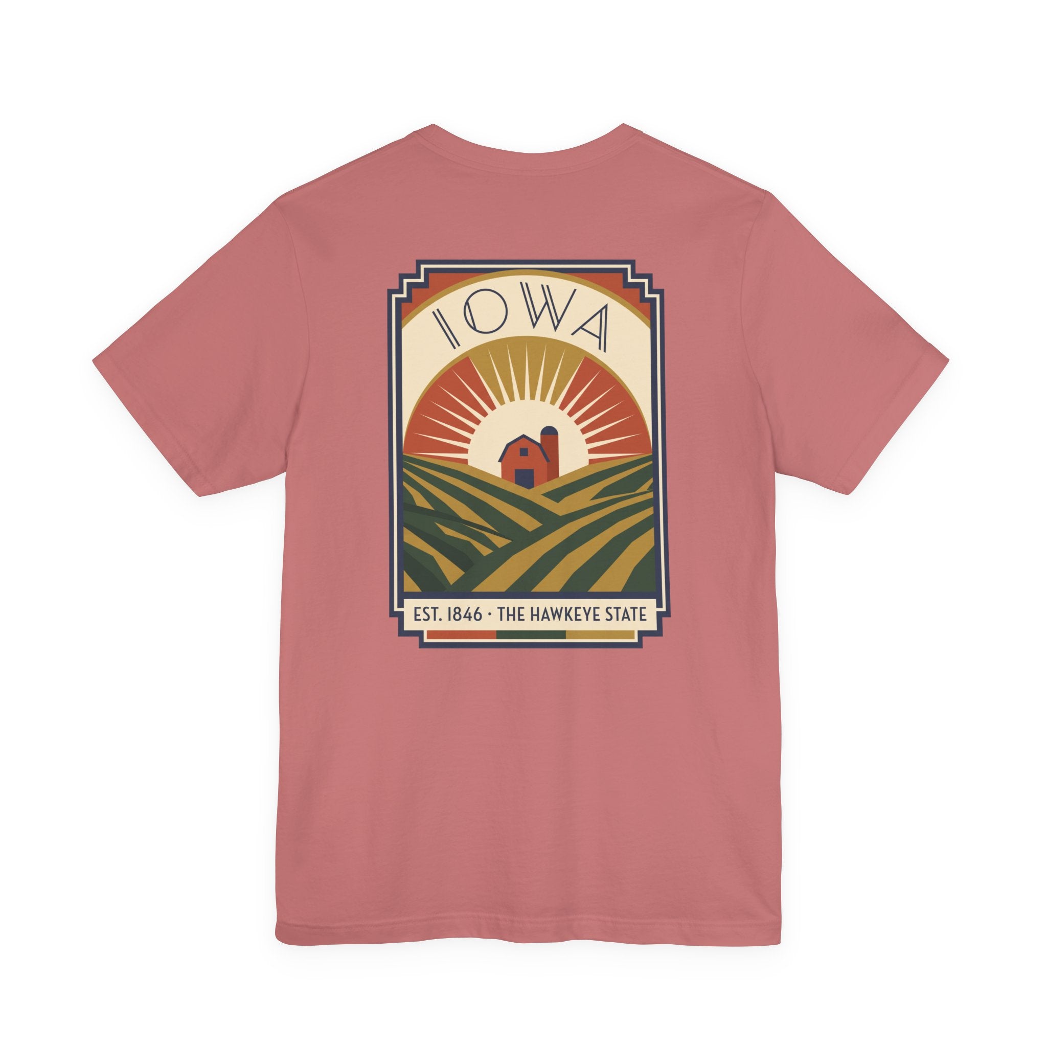 Dusty rose graphic t-shirt with large back Iowa scene emblem in square frame.