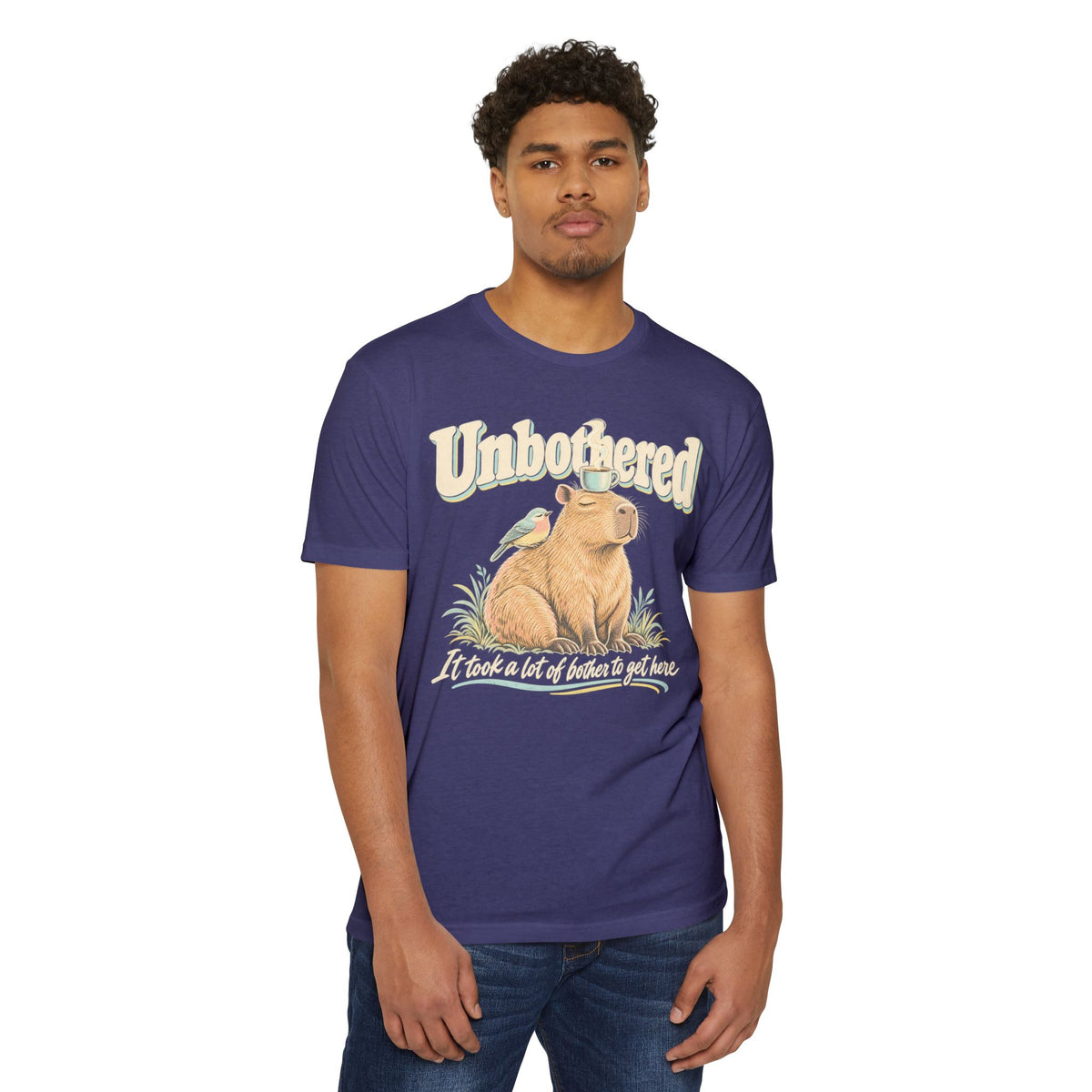 Purple crew-neck T-shirt with capybara graphic and 'Unbothered' front print