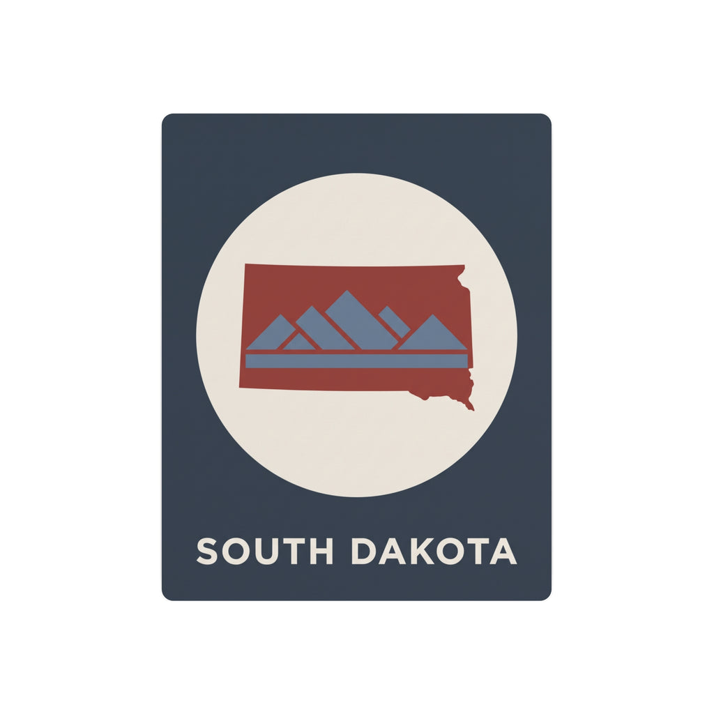 South Dakota metal art sign with circular emblem, red mountains on dark blue background