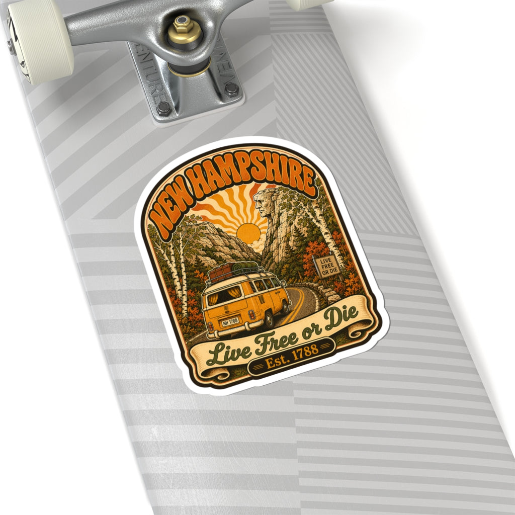 Kiss-cut New Hampshire sticker with yellow camper, forest road, sunrise, and “Live Free or Die”