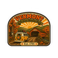 Vermont arched travel decal with van, covered bridge, autumn trees, and Est. 1791