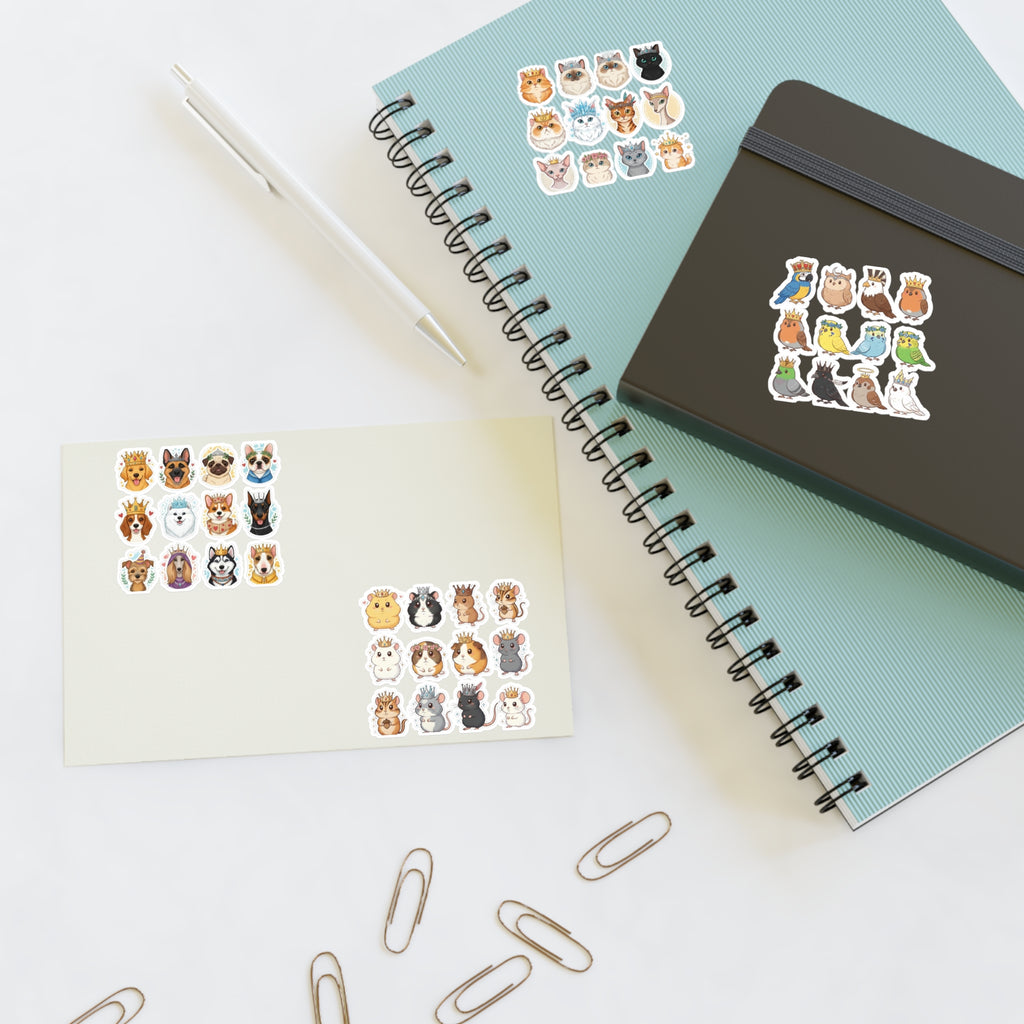 Royal Pets die-cut stickers on paper, beside notebook