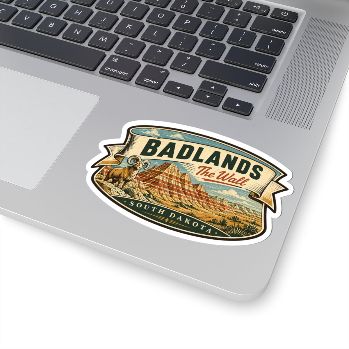 Badlands wall sticker with “BADLANDS” headline and desert hills, kiss-cut white outline
