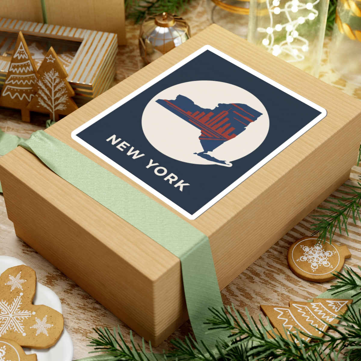 New York skyline sticker on gift wrap: blue border, red skyline state, and “NEW YORK”