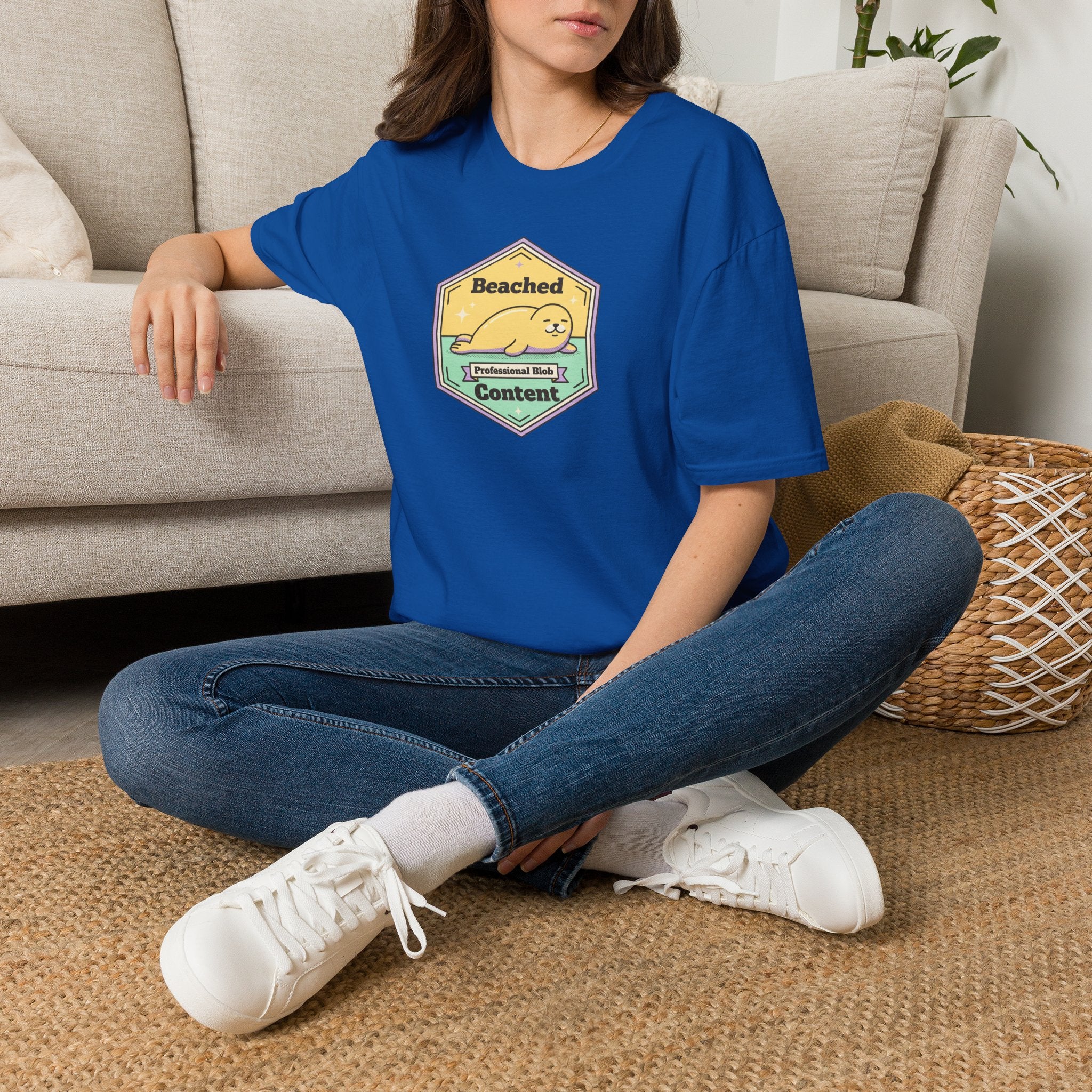 Royal blue T-shirt with chest Beached Content seal badge graphic and short sleeves
