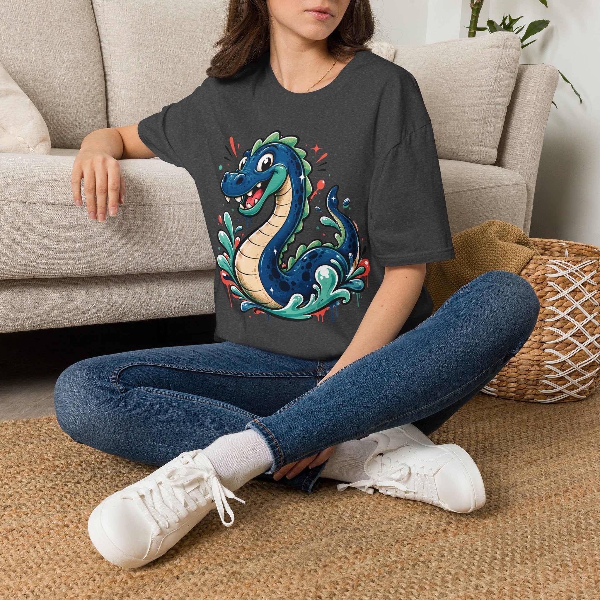 Charcoal crewneck T-shirt with colorful cartoon sea serpent graphic on front
