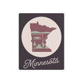 Minnesota metal wall art sign with state silhouette in pink and sage, circular frame, “Minnesota” script.