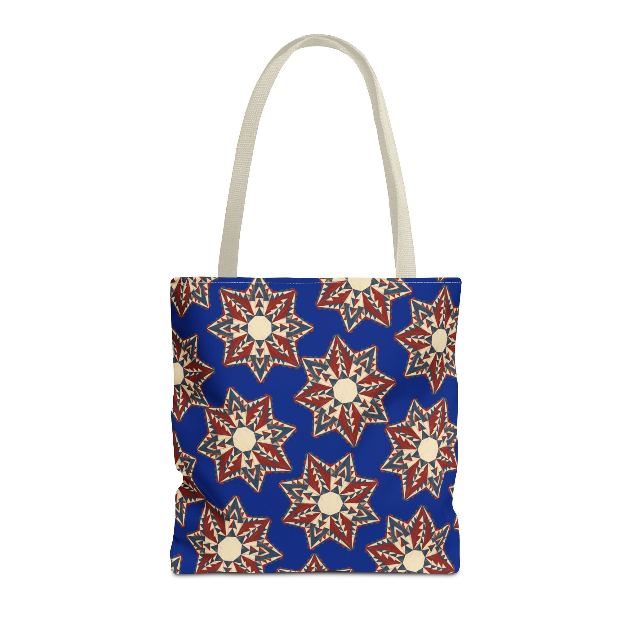 Blue tote bag with starburst floral mandala pattern and beige handles