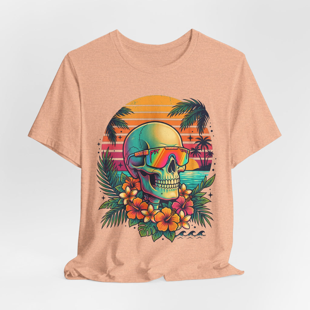 Heather peach T-shirt front with tropical skull, neon goggles, and hibiscus-style flowers