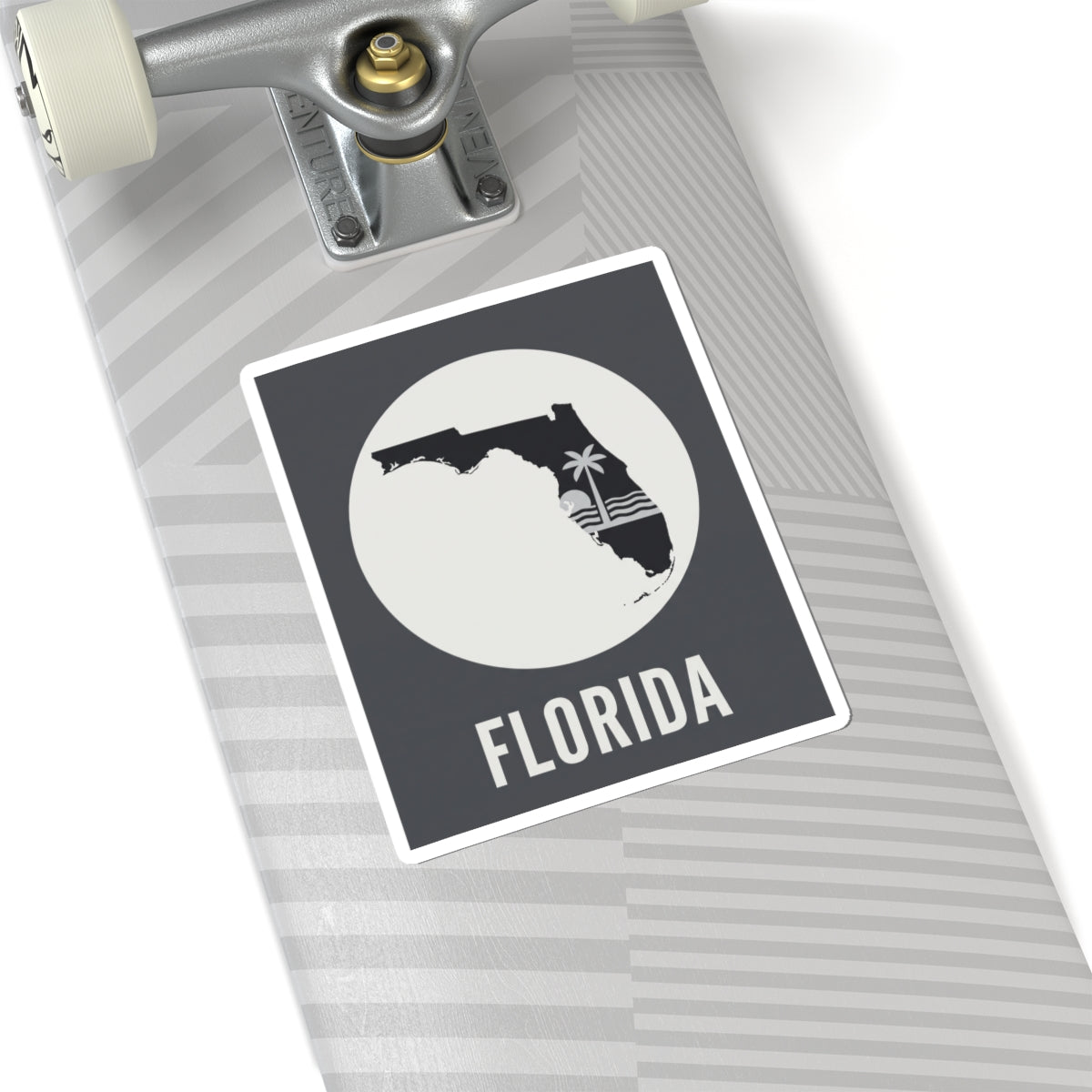 Florida silhouette sticker on notebook cover, circular palm wave graphic with FLORIDA text