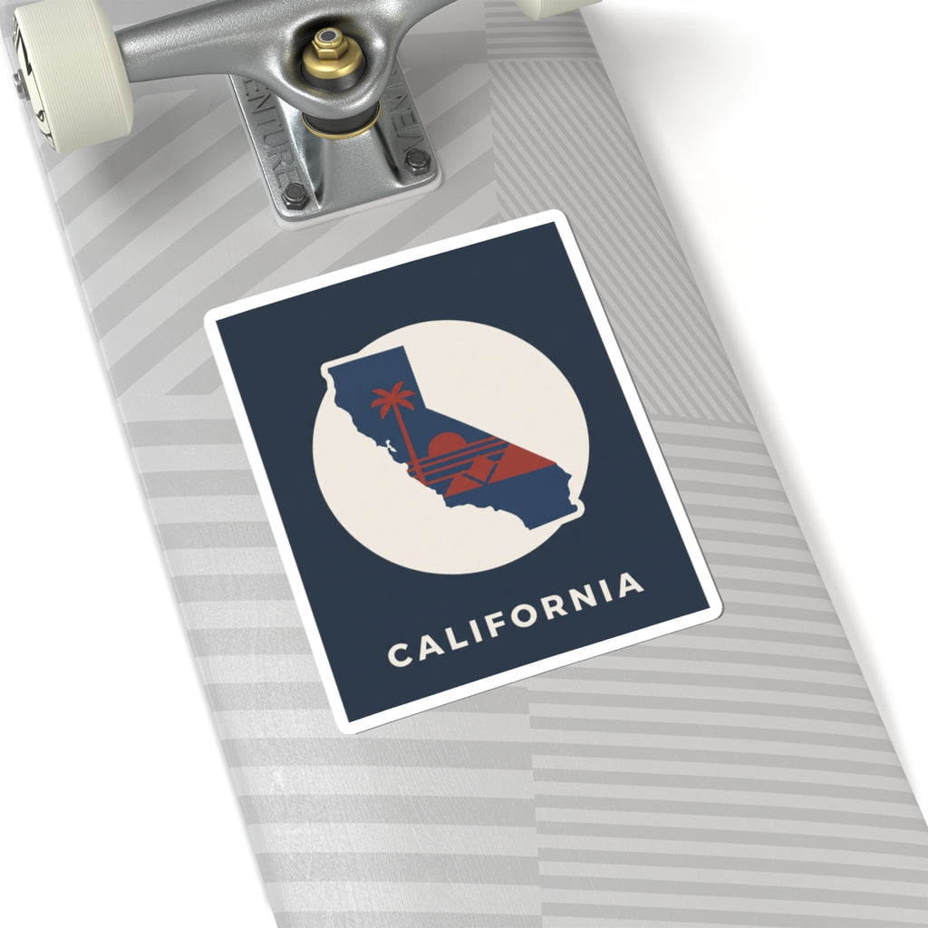 California silhouette sticker on a striped surface: navy square, white circle, red sunset, "CALIFORNIA"