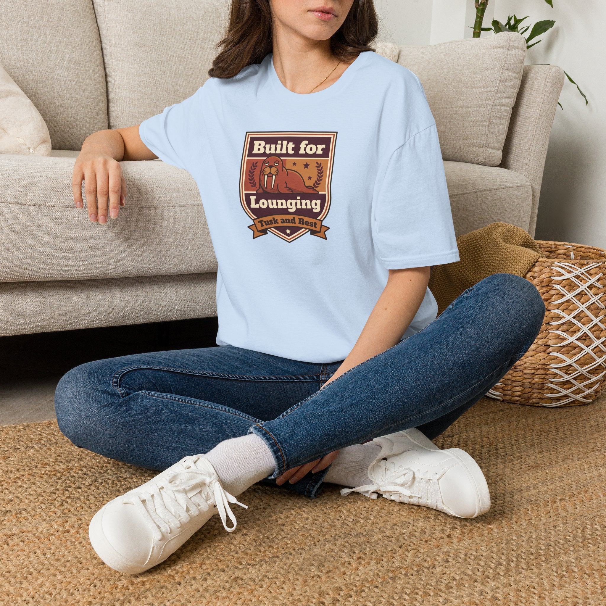 Light blue short-sleeve T-shirt with walrus logo graphic on chest