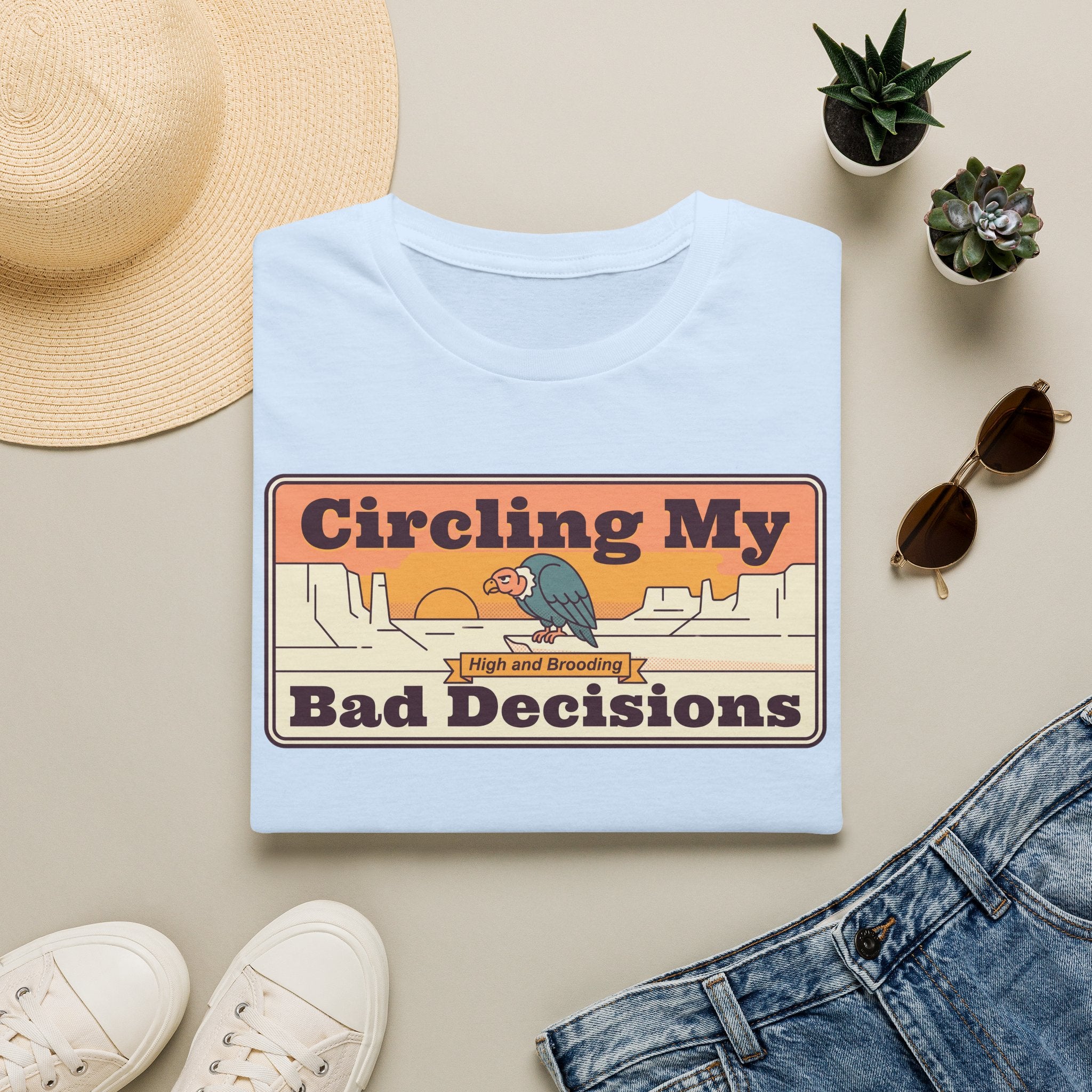 Light blue crewneck T-shirt with retro vulture "Circling My Bad Decisions" graphic