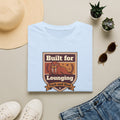 Light blue t-shirt with walrus graphic and “Built for Lounging” badge, short sleeves