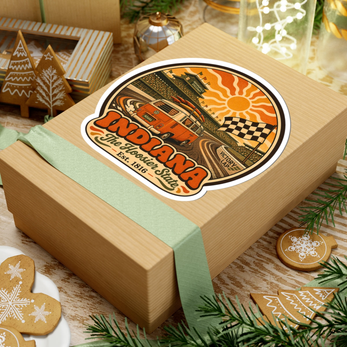 Round vintage racing van decal on wrapped gift box with orange sunburst and Indiana lettering