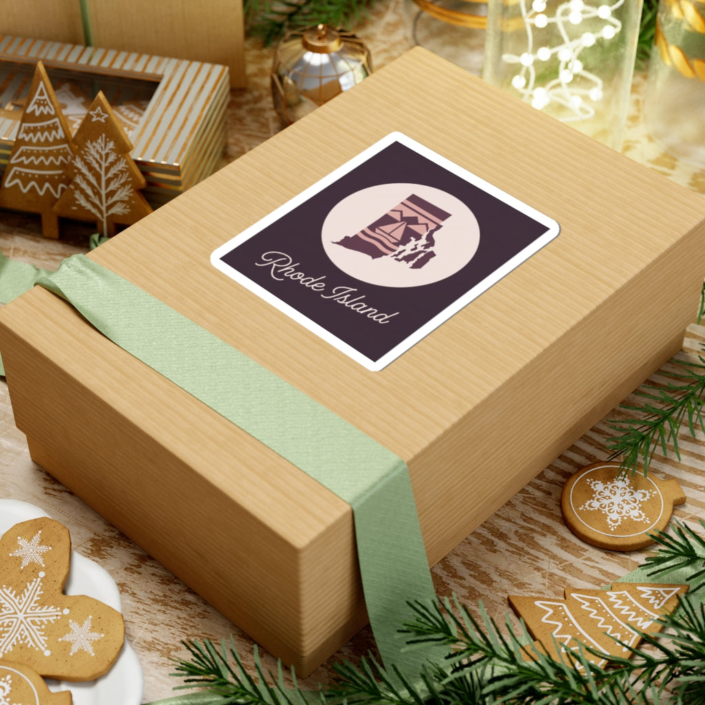 Rhode Island state silhouette decal on wrapped gift, circular lighthouse emblem and 'Rhode Island' cursive