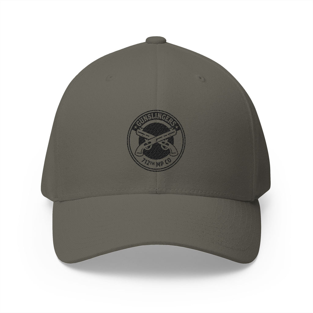Olive embroidered baseball cap with black circular emblem on front