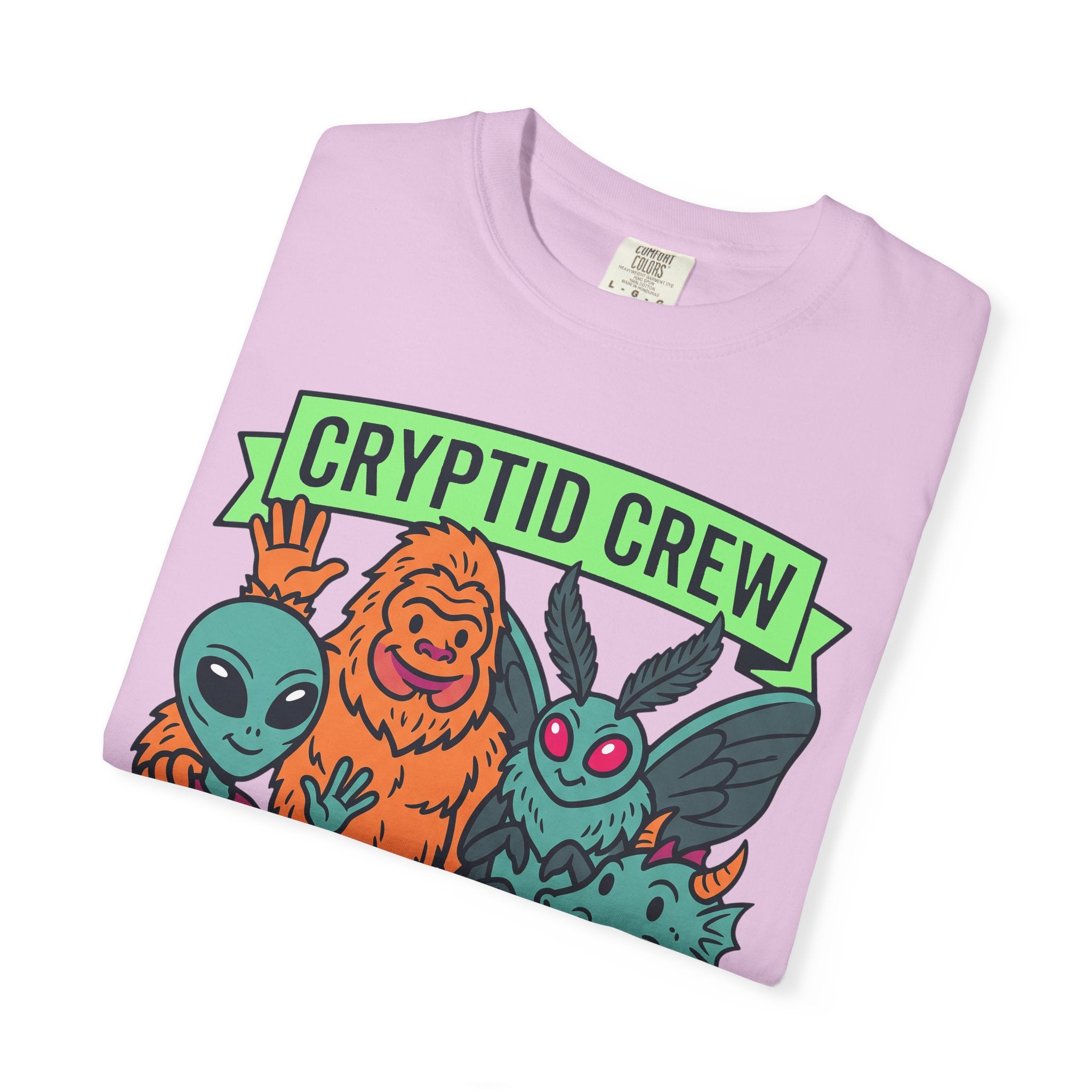 Light purple crew neck t-shirt with folded multicolor cryptid graphic and 'CRYPTID CREW'