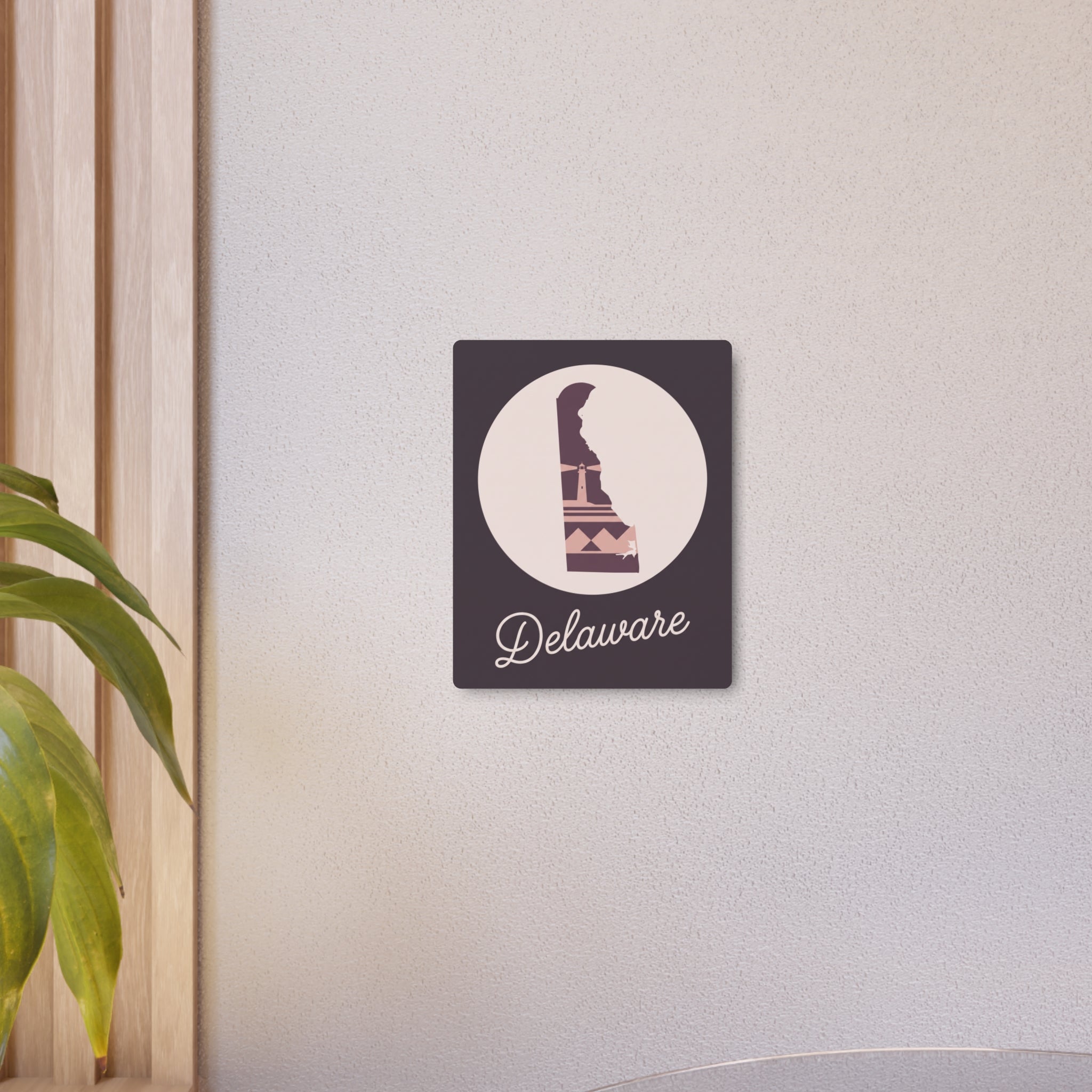 Wall-mounted square metal wall decor with circular Delaware icon and “Delaware” script