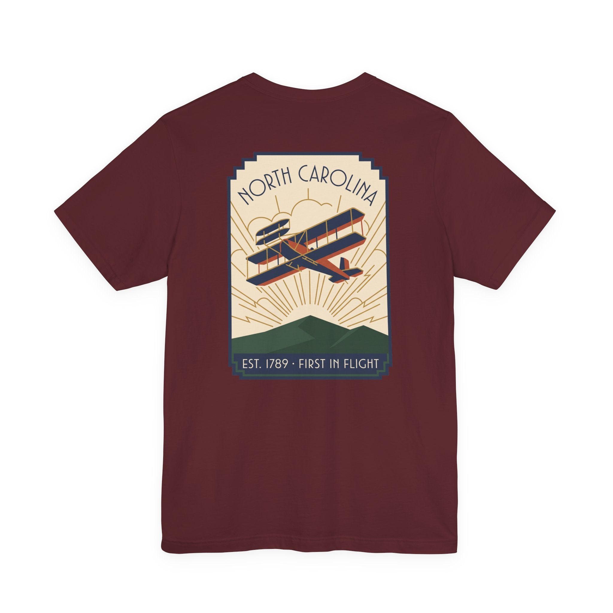 Maroon T-shirt with large North Carolina biplane graphic on the back