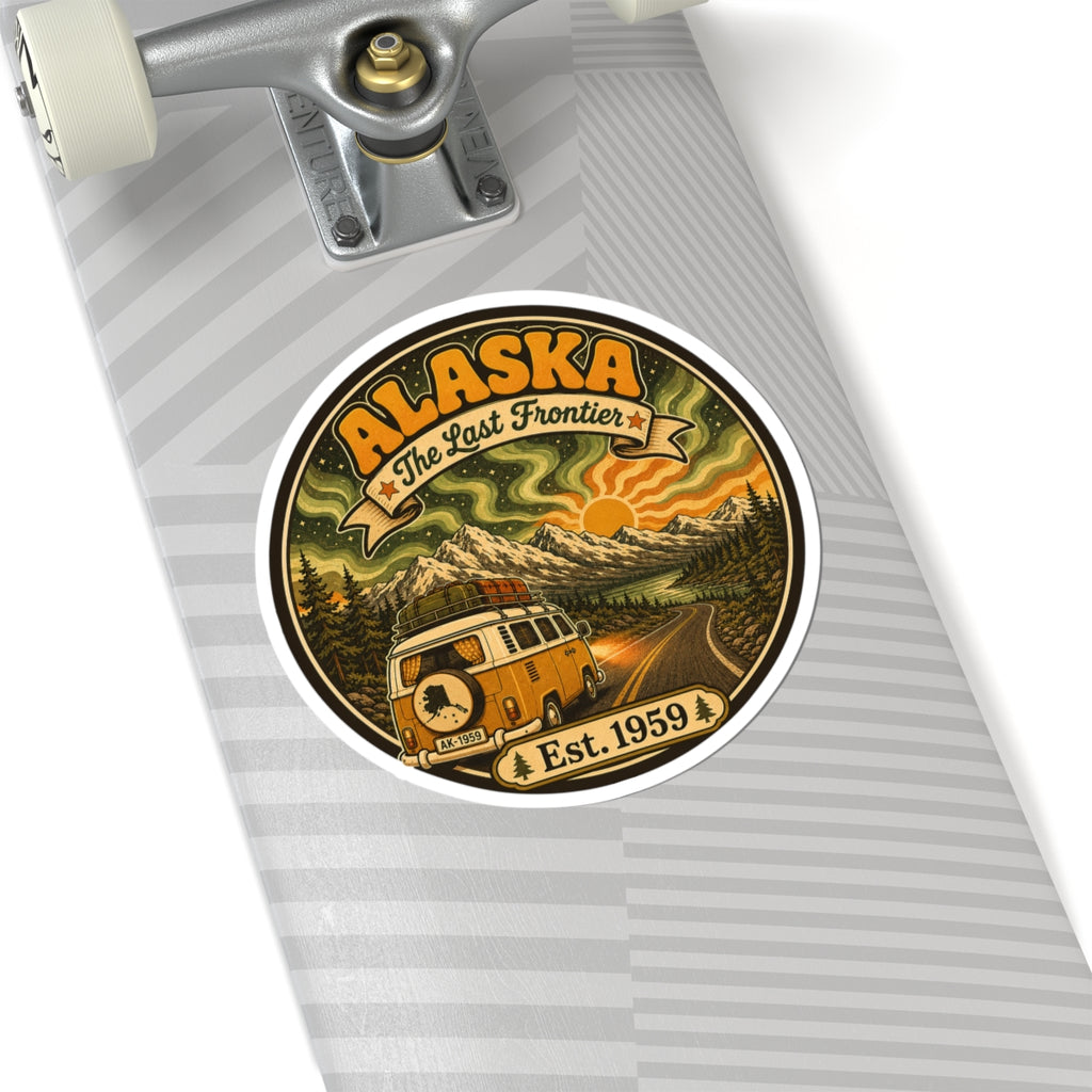 Round Alaska retro sticker on a silver notebook, with camper van, mountains, and Est. 1959