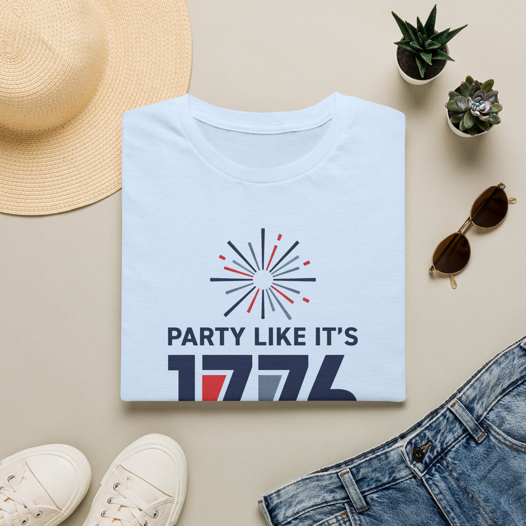 Light blue T-shirt with fireworks graphic and text “PARTY LIKE IT’S 1776”